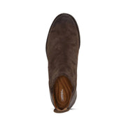 Top view of a dark brown ankle boot against a white background. 