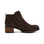 Side view of a dark brown ankle boot with a high heel on the back against a white background. 