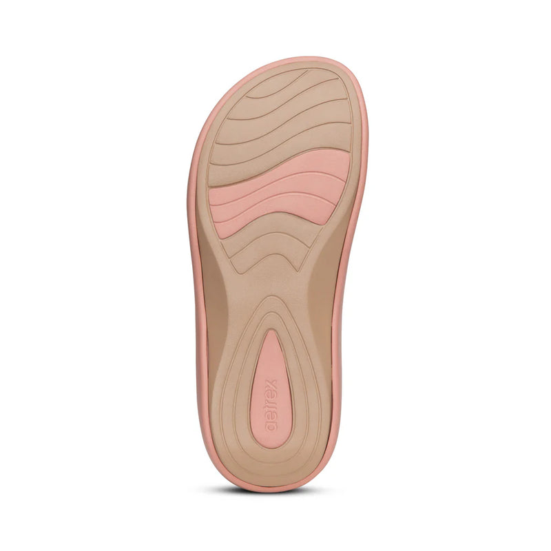 Pink and beige shoe sole on a white background