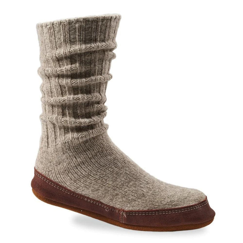 A gray slipper sock with a purple bottom on a white background