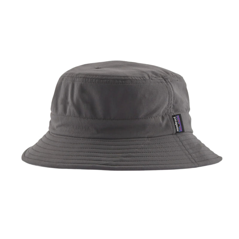 Gray bucket hat with a brand logo on a light gray background