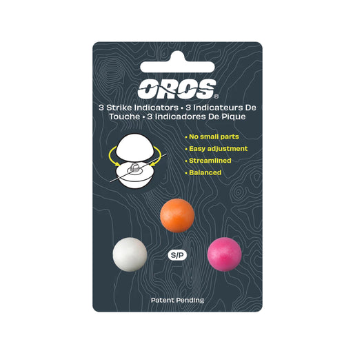 A retail package of three OROS strike indicators in white, orange, and pink, mounted on a dark gray card with product details and diagrams.