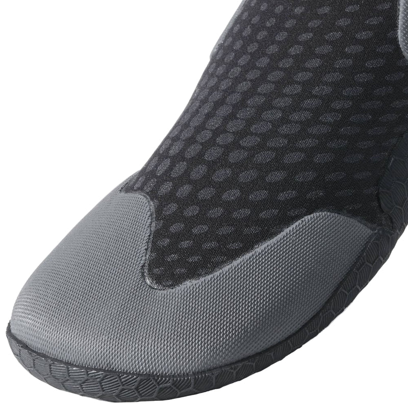 Close-up of a gray wetsuit boot with textured surface on a light gray background
