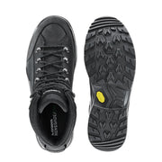 The top and bottom of black hiking boots on a white background