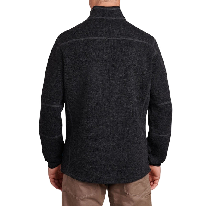 Dark gray fleece jacket worn by a person on a white background