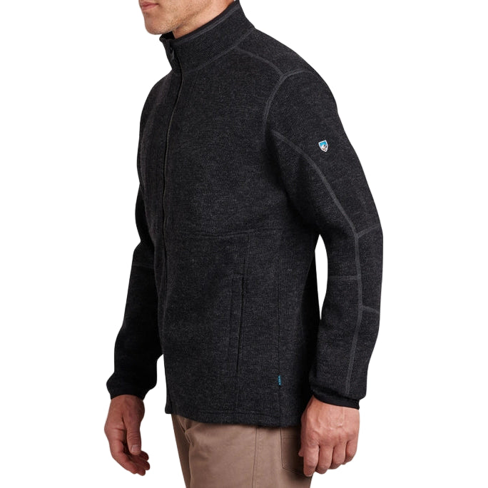 Man wearing a dark gray fleece jacket on a white background