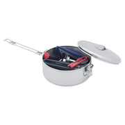 A stainless steel survival pot with an open lid, showing a dark interior filled with additional cookware, pot support, and utensils, on a solid white background