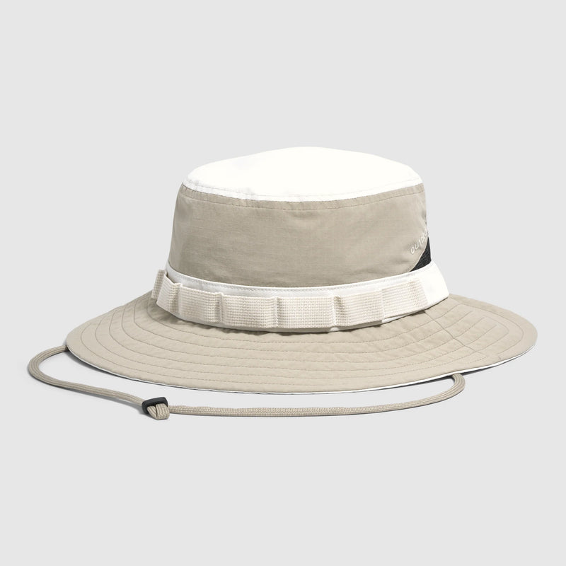 Beige bucket hat with white band on a light gray background