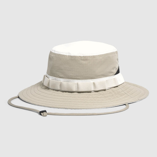 Beige bucket hat with white band on a light gray background