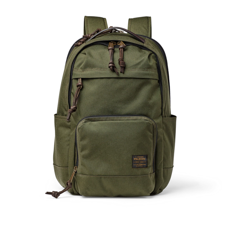 Front view of an olive colored backpack with many compartments against a white background. 