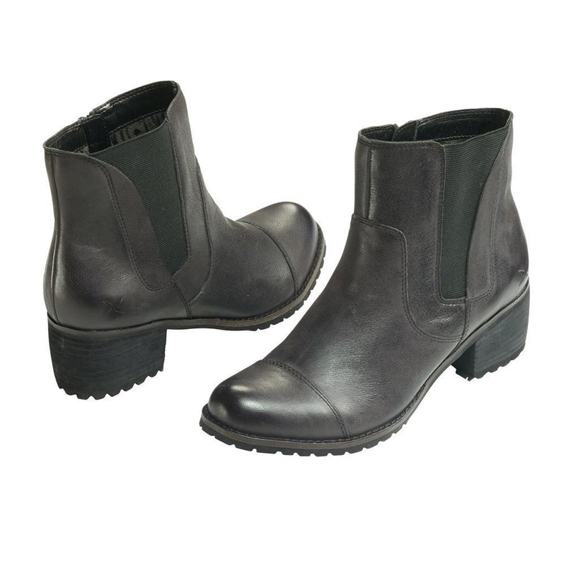 A pair of black ankle boots on a white background
