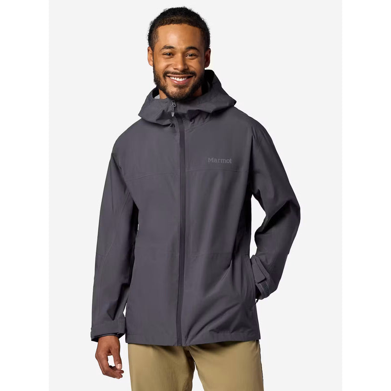 A man wearing a dark gray hooded rain jacket with a full front zipper and a small gray Menden brand logo on the left chest, paired with khaki pants, set against a plain light gray background.