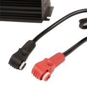 Close up image of a black cable and a red cable on a white background.