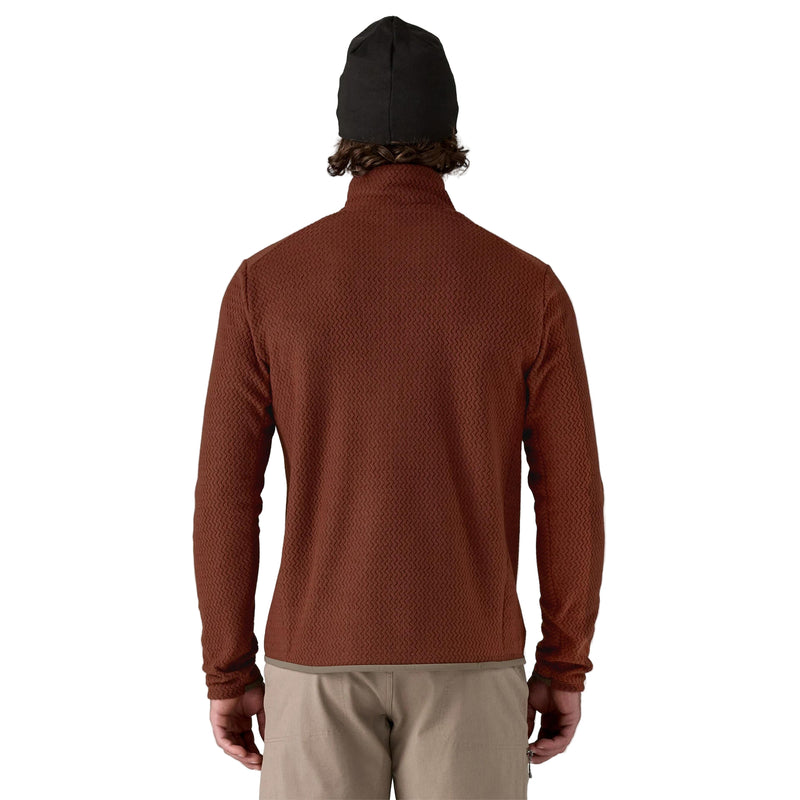Person wearing a brown textured pullover on a white background