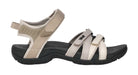 Pair of beige and black sandals on a white background