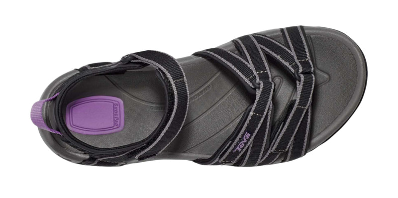 Black sandal with purple sole on a white background