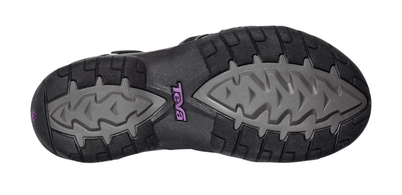 Black and gray sole of a shoe with a brand logo on a white background