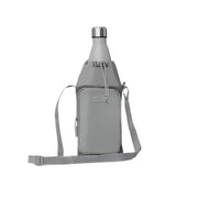 Gray crossbody bag with a bottle inside on a white background