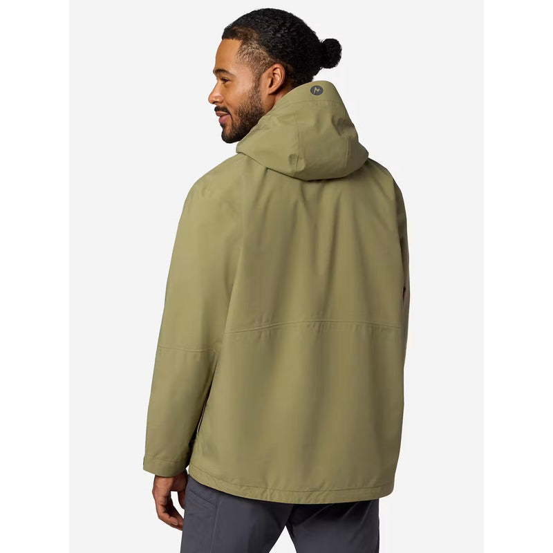 A man wearing an olive green hooded jacket, shown from a three-quarters back view against a light gray studio background.