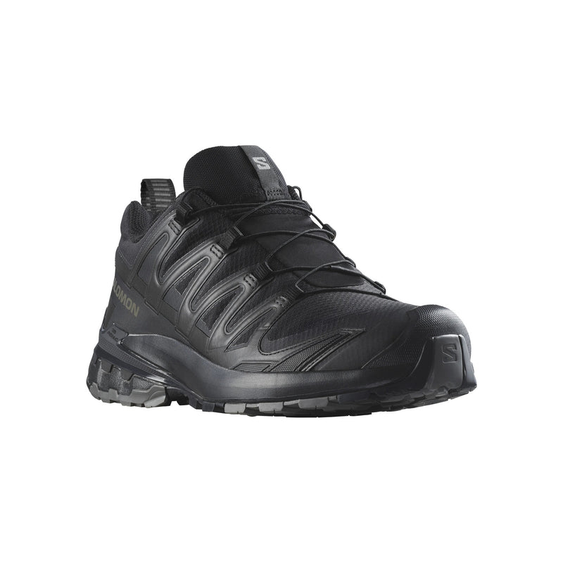 A Salomon low-top athletic shoe in black, featuring a textured synthetic upper, lace-up closure, and rugged sole, shown from a three-quarters angle on a white background.