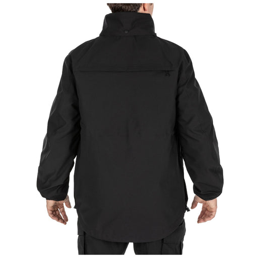 The back of a person wearing a black jacket on a white background