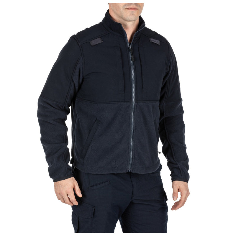 A person wearing a black jacket on a white background