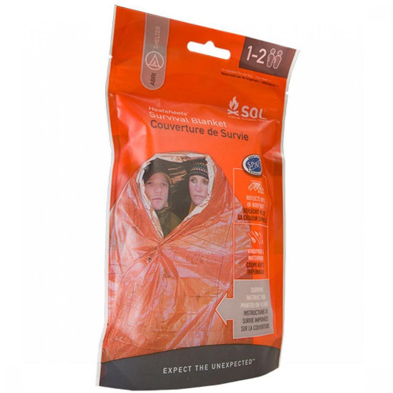 An orange bag with an orange survival blanket inside on a white background