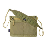 A green cross body bag on a white background