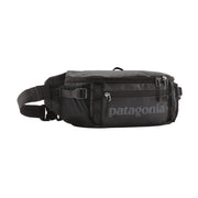 A black waist bag on a white background