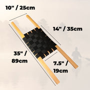 Dimensions of a tan canoe seat with black webbing in the center against a white background. 