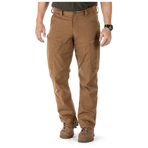 A person wearing brown cargo pants on a white background