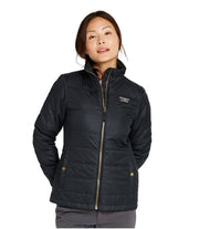 Woman wearing a black jacket with a visible brand logo on a white background