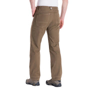 Brown pants worn by a person on a white background