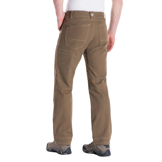 Brown pants worn by a person on a white background
