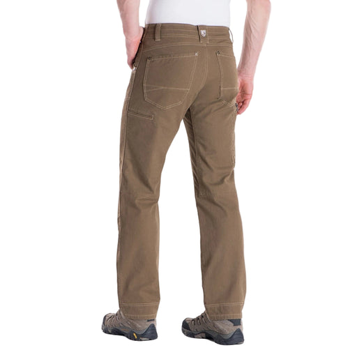 Brown pants worn by a person on a white background