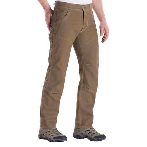 Brown pants worn by a person on a white background