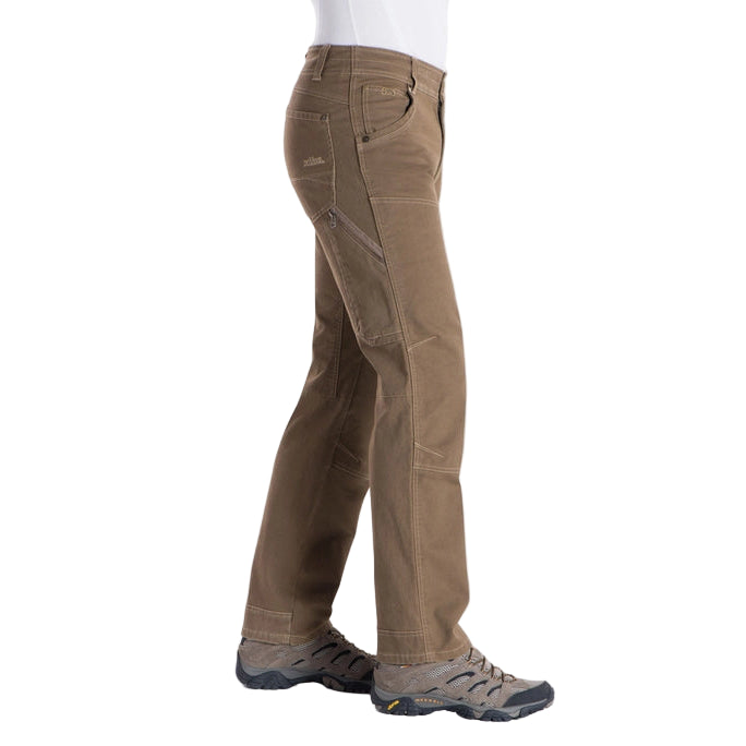 Brown pants worn by a person on a white background
