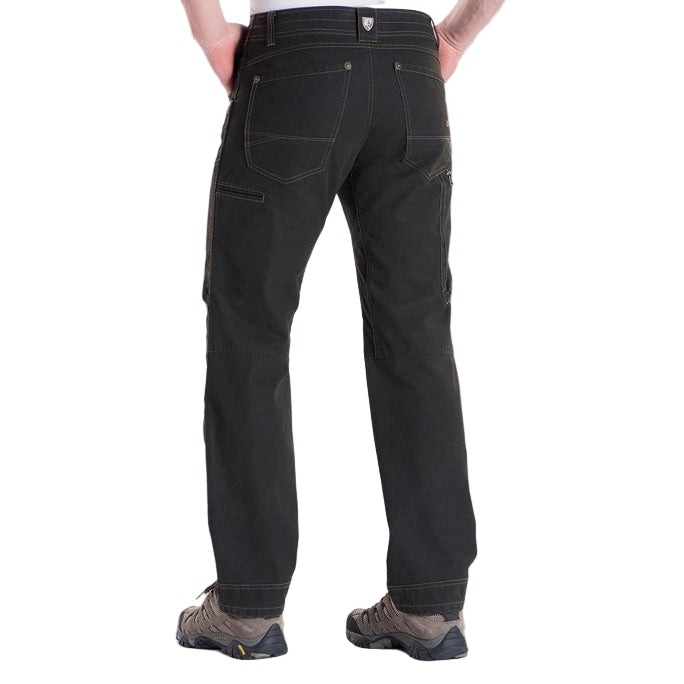 Person wearing black pants on a white background