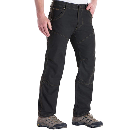 Person wearing black pants on a white background