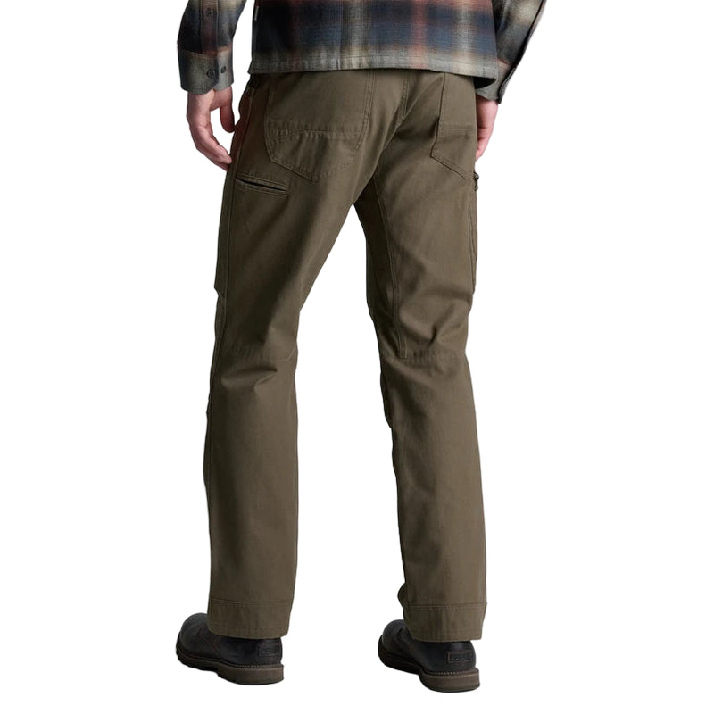 Person wearing olive green pants on a white background