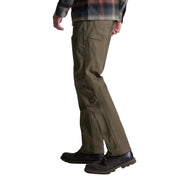 Person wearing brown pants and a plaid shirt on a white background