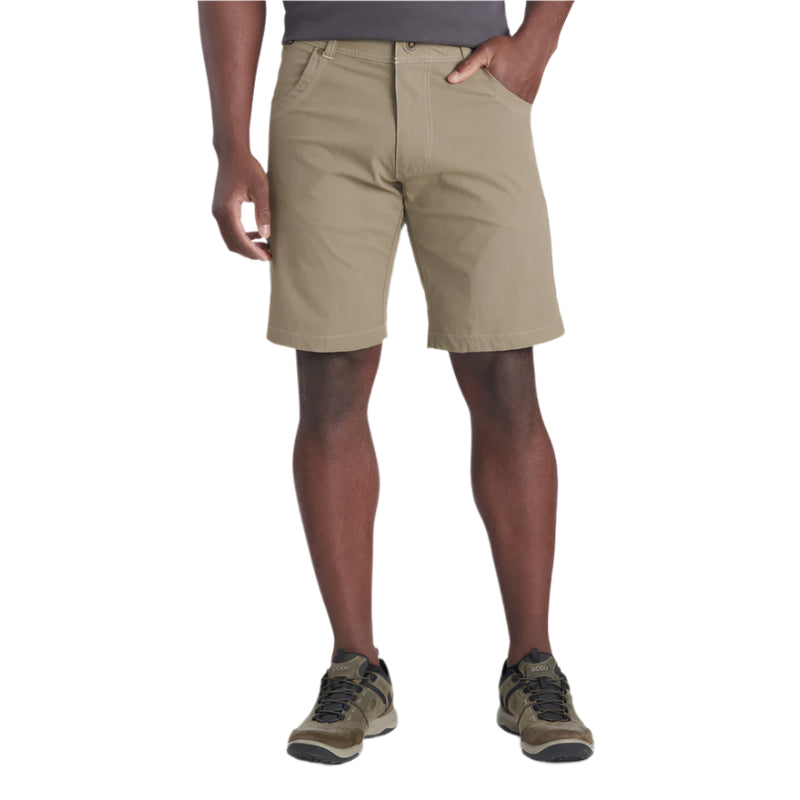 Person wearing beige shorts on a white background