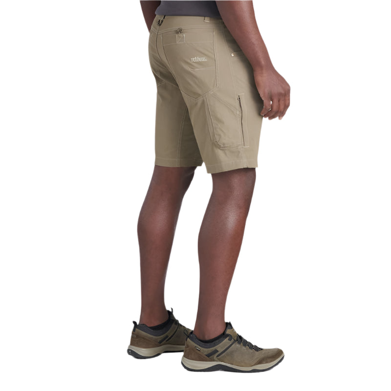 Person wearing beige shorts on a white background