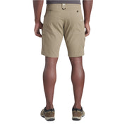 Person wearing beige shorts on a white background