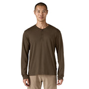 Man wearing a brown long-sleeve henley shirt on a white background