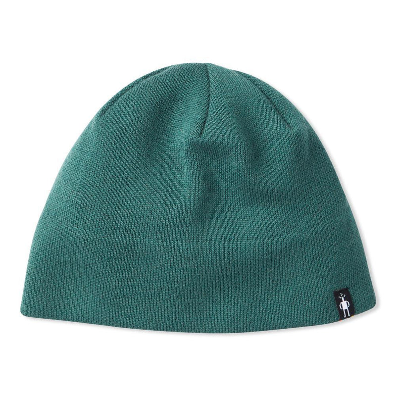 A turquoise beanie hat on a white background