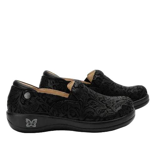 Black floral-patterned shoes on a white background