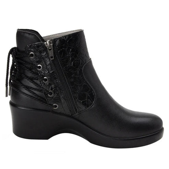 Side view of a black ankle boot with a lace pattern on the back against a white background. 