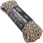 A coiled roll of multicolor paracord rope with a black paper label wrapped around it, photographed on a plain white background. The label reads '550 PARACORD', '100 ft / 30m', and shows the brand 'Lupaca' with 'USA' text.