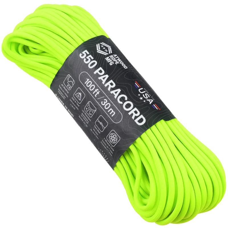 A coiled bundle of bright neon yellow-green paracord wrapped with a black paper label that reads '550 PARACORD 100ft 30m USA'.